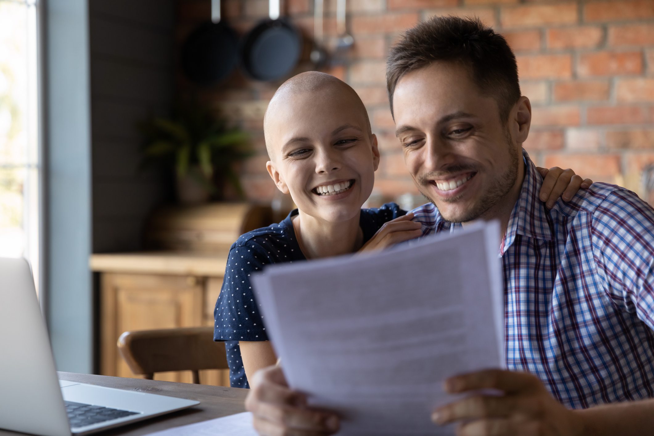 Happy wife with cancer and husband getting good news